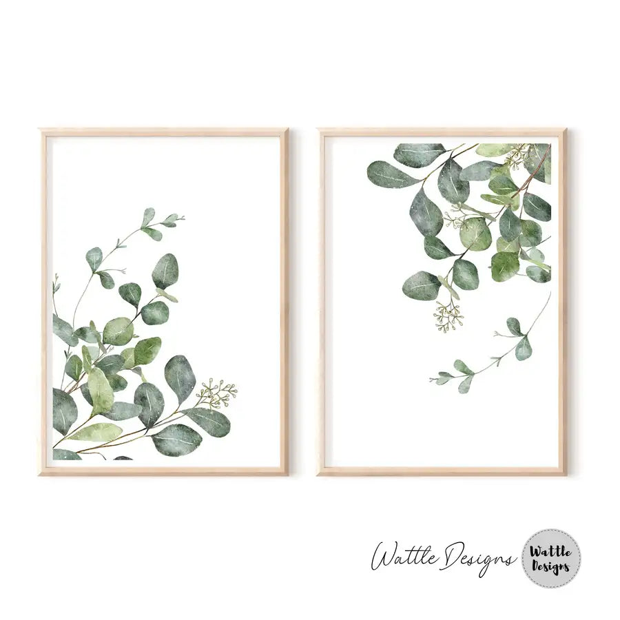 pair of framed leaf prints