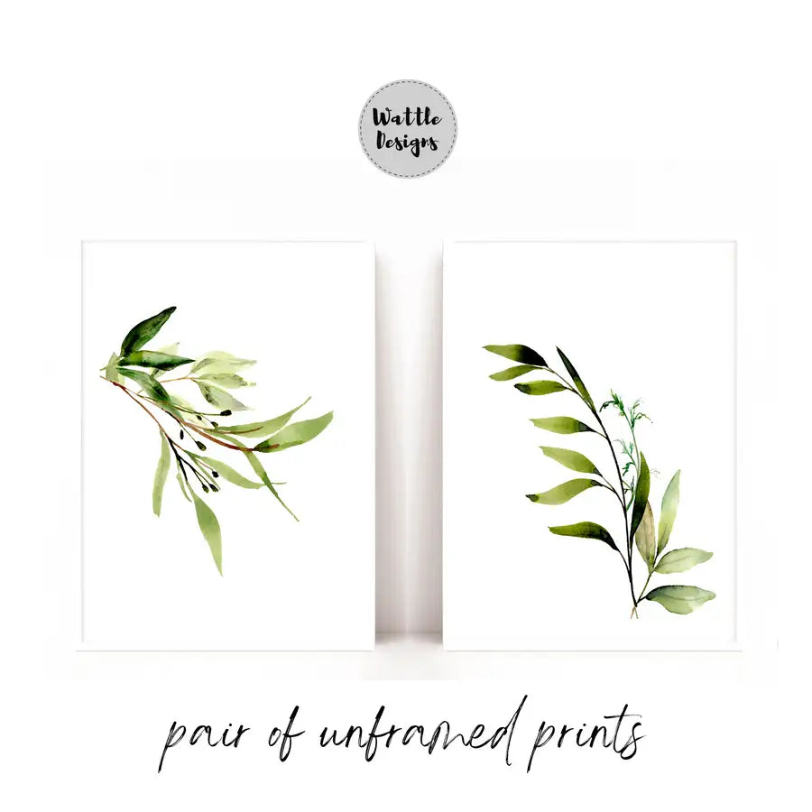 pair of unframed prints with green eucalyptus leaves